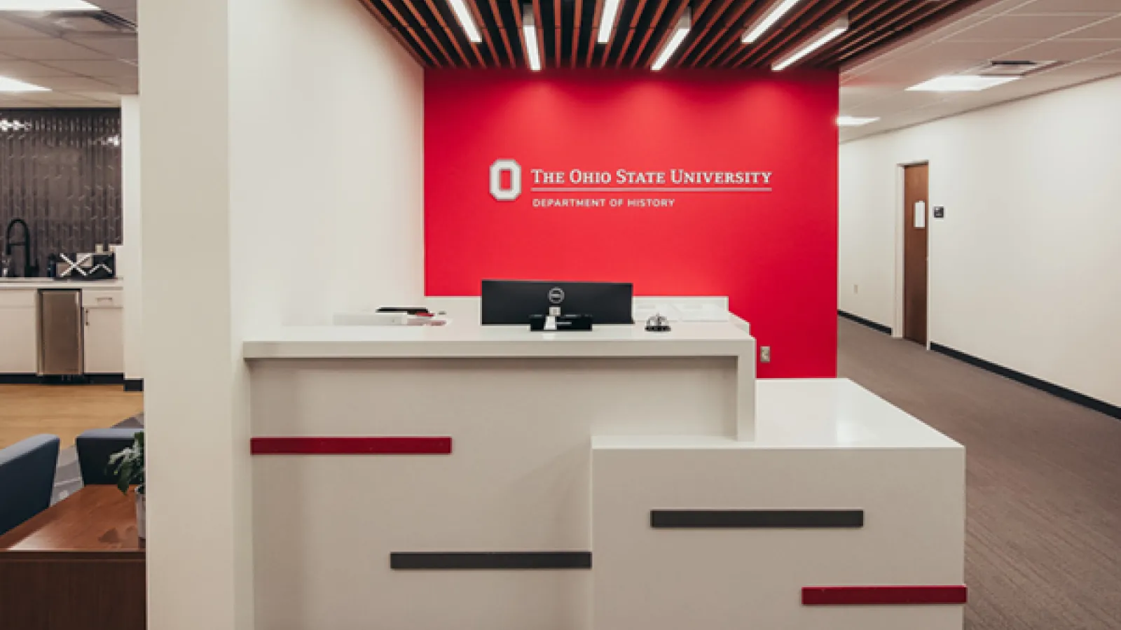 front desk with department of history sign behind it