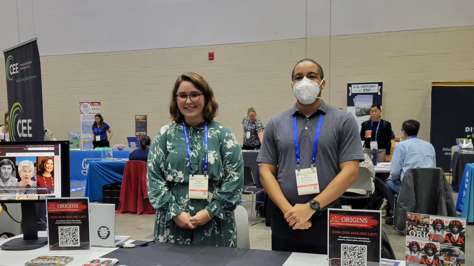 Kristin Osborne and Paul McAllister standing behind a table