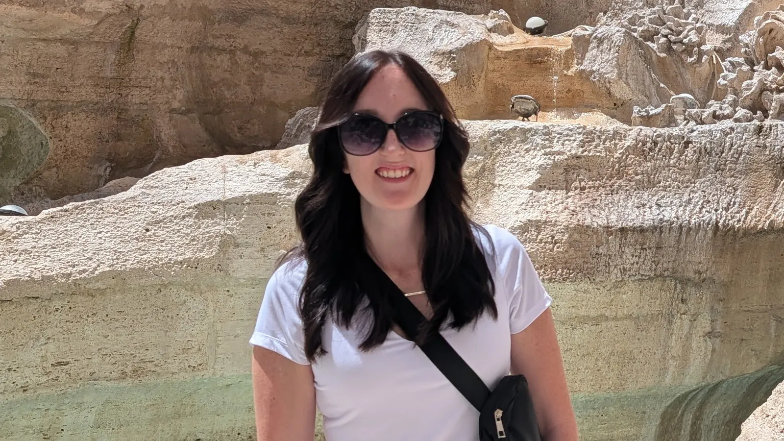 Kari Swygart standing at Trevi Fountain