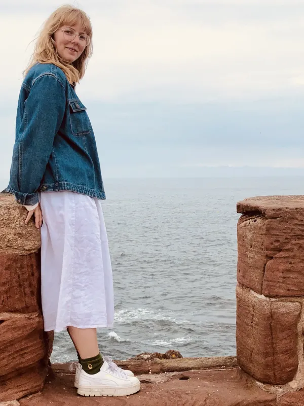 Portrait photo of Victoria smiling seaside