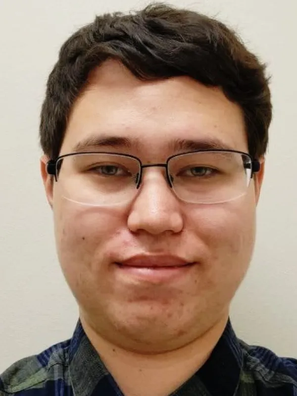 Selfie of Chris, imagine an acne laden guy with glasses and lifeless stare