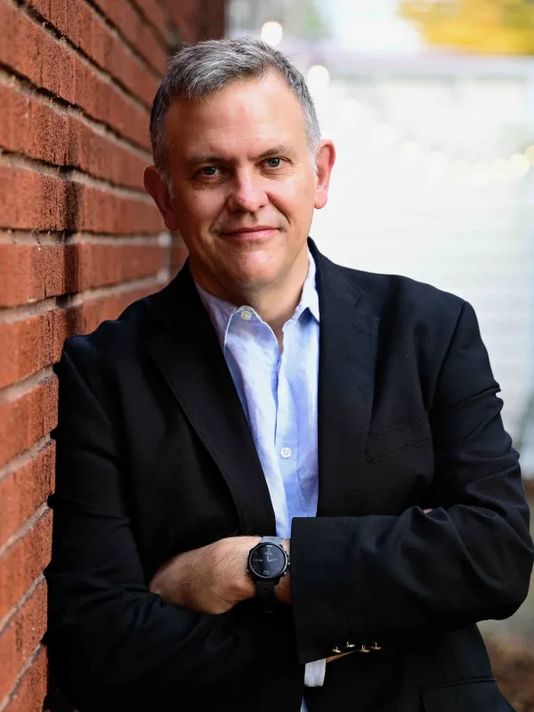 photo to Thomas McDow leaning against a wall